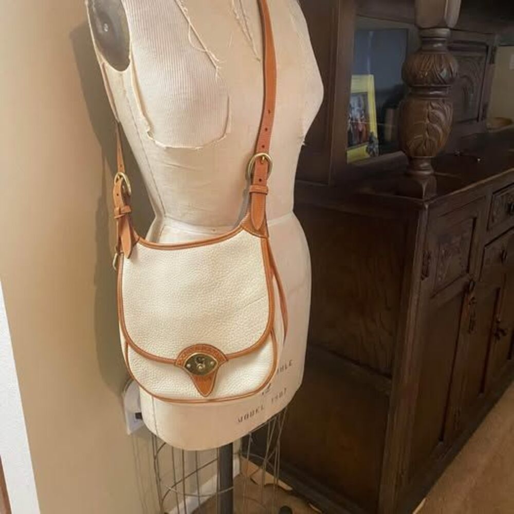 Vintage Dooney and Bourke shoulder/cross body bag in like new condition.